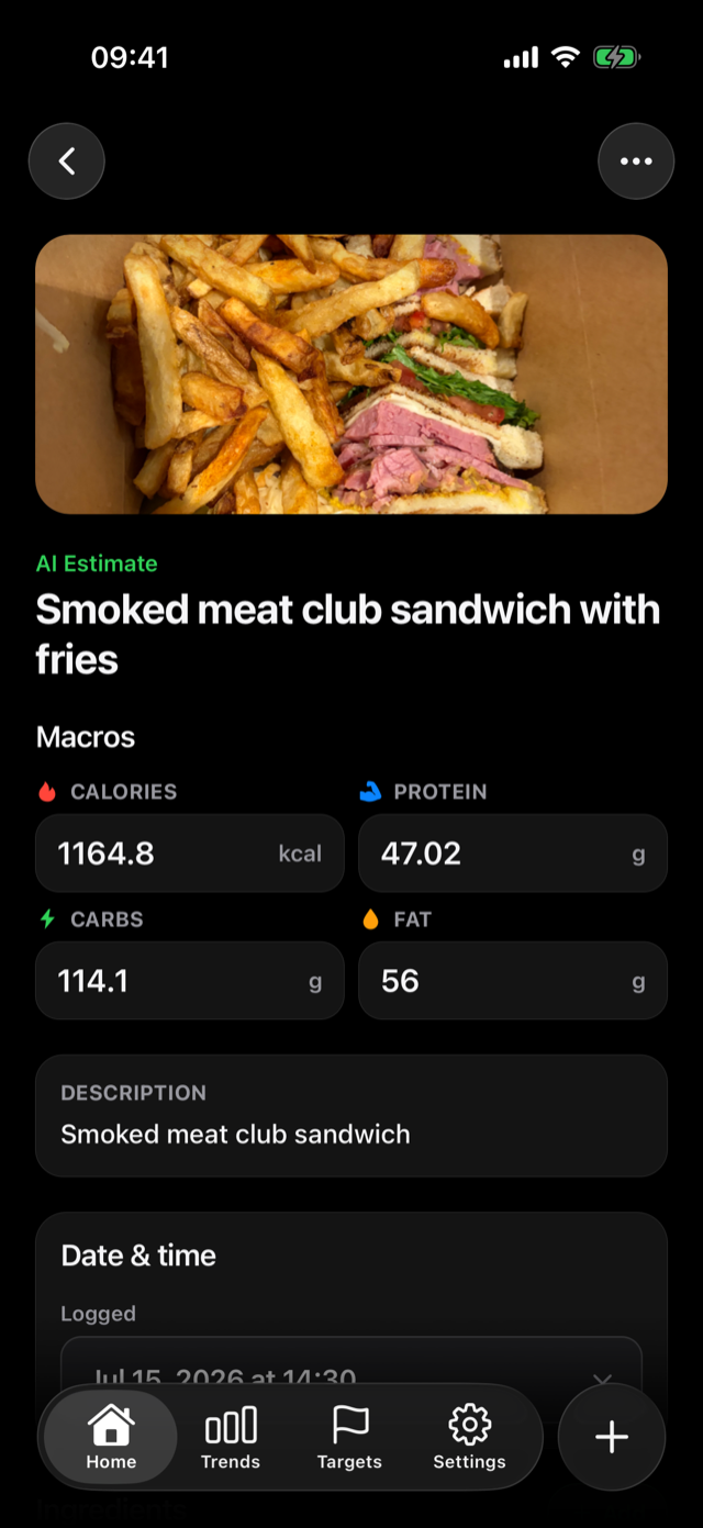 Meal detail in dark mode with photo, AI estimate label, and editable macros