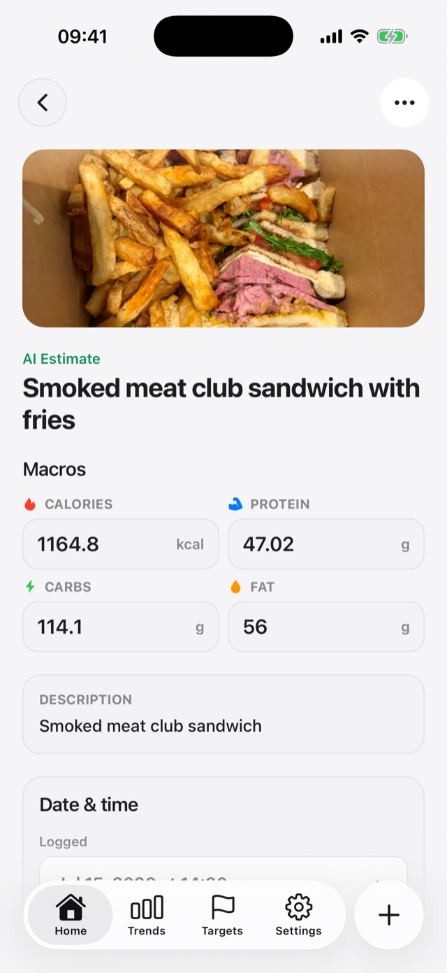 Meal detail with photo, AI estimate label, and editable macros